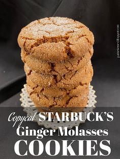 three ginger molasses stacked on top of each other in front of a black background