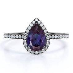 a pear shaped purple sapphire and diamond ring