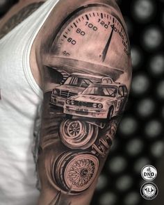 a man's arm with a car and speedometer on it