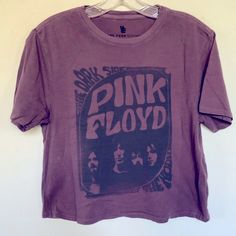 a pink floyd shirt hanging on a wall