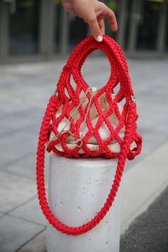 Made from red cotton for durability and a vibrant look. Cerated by women for women. Is made with organic 100% cotton.  Crochet avoska style, perfect for shopping or casual outings. Handle designed for shoulder wear, offering comfort and practicality. Crossbody style, making it versatile and hands-free. Eco-friendly design, aligning with sustainable fashion trends. This bag is a chic and practical accessory, perfect for everyday use or as a fashionable statement piece.  By the way this can be an Macrame Bag, Eco Bag, Purse Pouch, Cotton Bag, Crochet Bag, Sustainable Fashion, Purses And Handbags, Crossbody Bag, Bag Lady