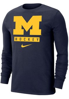 Show off your team pride in this Michigan Wolverines Navy Blue Dri-FIT Hockey Long Sleeve T Shirt! This Michigan Long Sleeve Tee features a screen print of Michigan team logo over "Hockey" on front chest. Make sure everyone knows you root for the Wolverines with this Navy Blue Michigan T Shirt. Go Michigan! Dri-FIT moisture-wicking technology, Classic fit, Crew neckline, Screen printed team graphic on left chest, Team graphic down right sleeve, Iconic Nike swoosh below team graphic, 57% COTTON / Navy Team Logo Fan Apparel Top, Navy Tops With Team Logo For Sports Season, Navy Tops With Team Logo For Fan Gear, Navy Tops For Sports Season Fan Gear, Collegiate Navy Top For Game Day, Navy Fan Apparel Tops For Sports, Navy Fan Apparel Tops For Sports Events, Navy Team Spirit Tops With Logo, Navy Team Spirit Tops With Team Logo