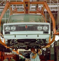 a car being worked on in a factory