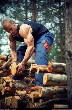 a man chopping wood in the woods