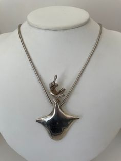 "Fabulous Brutalist pendant with huge modern design and a  person on top of in a squat down position. Very interesting sculpture with a thick snake style chain and a hand made unique clasp matching the modern design.  Truly one of a kind hand made from sterling silver. The chain measures18\" with the stylish hook type clasp. There is only a 925 for its sterling silver content stamp on it no makers mark." Makers Mark, Pendant Necklaces, Jewelry Necklace Pendant, Modern Design, Jewelry Necklaces, Bathing Beauties, Stamp, Pendant Necklace, Electronic Accessories