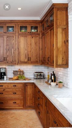 a kitchen with wooden cabinets and marble counter tops in the center is an advertisement for international bamboo doors