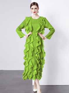 Emanate a vibrant energy in this striking green ruffle dress, a bold statement piece designed for the fearless fashion enthusiast. With its electrifying hue, this dress is a wearable expression of confidence and individuality. The unique pleated texture, combined with the cascading ruffles from the waist down, creates a sense of dynamic movement, echoing the rhythm of the wearer's stride. The elongated cuffs and structured shoulders craft a silhouette that's both modern and timeless. It's an ide Dark Green Evening Dress For Spring, Summer Party Dark Green Midi Dress, Green Ruffled Midi Dress For Party, Spring Dark Green Midi Dress, Chic Dark Green Midi Dress For Spring, Green Ruffle Dress For Summer Party, Dark Green Ruffled Dress For Party, Dark Green Elegant Ruffle Dress, Dark Green Spring Party Midi Dress