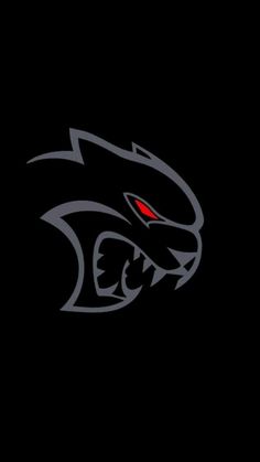 a black background with a red eye and an angry cat's head in the center