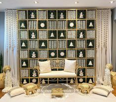 a living room filled with lots of furniture next to a wall covered in bookshelves