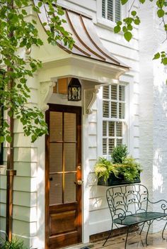 a white house with a wooden door and window