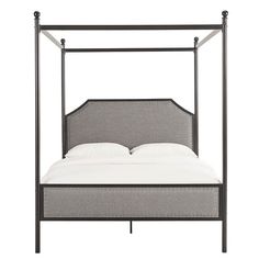 an iron bed frame with white sheets and pillows on the bottom, against a white background