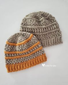 two crocheted hats sitting next to each other