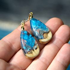 "Wood resin earrings. Northern lights art. Epoxy earrings. Wood resin jewelry. Epoxy art jewelry. Wood resin art. Gift for her ♥ This item is handmade, so each piece is unique. The piece you receive will be based on this design and very similar to photos. ♥♥ Please see the current discounts in the shop announcement: https://www.etsy.com/shop/TSMDecorations The perfect gift for a special person.  These unique teardrop pearlescent earrings are handmade using precious burl wood and clear art resin. Resin Wood Art, Wood Resin Earrings, Epoxy Earrings, Northern Lights Art, Wood Resin Jewelry, Epoxy Art, Jewelry Wood, Earrings Wood, Transparent Resin