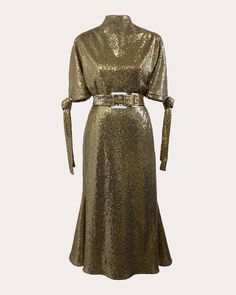 a gold sequinned dress with long sleeves and a belt on the waist,