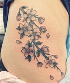 a woman's stomach with flowers on it