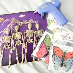 the skeleton and butterflies are being displayed for children to use on halloween crafts, like this one