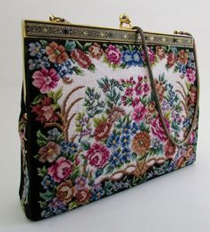 an embroidered purse with flowers on it