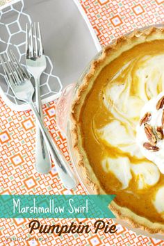 a pumpkin pie with whipped cream and pecans in the crust is on a table