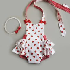 "This isvery cute baby girl romper with yummy strawberry design. It is perfect for cake smash photoshoot, with it's bright and joyful colours will look great in photos and will create beautiful memory! This strawberry romper is made from high quality cotton poplin fabric, embelished with cute little bows at the shoulders. Also matching strawberry booties and bow headband are available for the complete look. It is great outfit for baby in joyful fruit design. Outfit is available in sizes from new Strawberry Shortcake 1st Birthday Party Outfit, Strawberry 1st Birthday Outfit, Strawberry Shortcake Baby Outfit, Strawberry Shortcake Birthday Outfit, Strawberry Baby Outfit, Strawberry Photoshoot Baby, Strawberry Baby Photo Shoot, Strawberry Shortcake Photoshoot, Strawberry Smash Cake First Birthdays