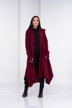 "Wool Cape, Knit Cardigan, Cloak with Hood This asymmetrical and modern cloak with hood has two side pockets, super comfy hood and thumb holes for a fabulous look. The model in the picture is 168cm. ⅼ 5.6 ft. tall and is wearing size S / color: burgundy 🌟 INFO: * Worldwide EXPRESS shipping - please provide a phone number for shipping documents * US Sizing XS to 4XL - body size chart available below * We offer customization to Personal Measurements & Larger Sizes 5XL, 6XL, 7XL .... 🌟 MATERI Trendy Hooded Sweater Coat For Fall, Oversized Hooded Trendy Cardigan, Trendy Oversized Hooded Cardigan, Oversized Hooded Winter Cardigan, Hooded Lagenlook Hoodie For Fall, Oversized Hooded Cardigan For Fall, Lagenlook Long Sleeve Hoodie For Winter, Winter Lagenlook Long Sleeve Hoodie, Hooded Lagenlook Outerwear For Fall