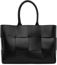 Intreccio-woven buffed calfskin tote in black. · Twin rolled carry handles · Detachable zip pouch at interior · Open throat · Bonded suede lining · H11 x W16 x D4 in Supplier color: Black/Silver Black Woven Leather Business Bags, Black Business Bags With Braided Handles, Black Business Bag With Braided Handles, Black Woven Leather Bag For Office, Black Woven Leather Office Bag, Bottega Veneta Arco, Bucket Tote, Suede Tote, Latest Bags