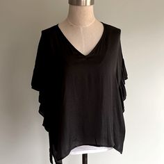 Brand New Anthropologie Double Raffled Sleeve Top Will Go With Any Outfit. It Has V-Neck On A Shorter Side, Small Vents. Color Black With Gray Speckles See Picture. Size S Oversized Look. Ptp 24” L 24” Trendy Black V-neck Top For Summer, Solid V-neck Blouse For Layering, Chic V-neck Blouse For Layering, Chic V-neck Top For Layering, Black V-neck Summer Blouse, Black V-neck Top Versatile Style, Chic Black Long Sleeve V-neck Top, Chic Black Blouse For Layering, Black V-neck Blouse For Layering