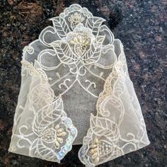 RARE FIND Vintage embroidered lace handkerchief in ivory color. Unique floral embroidered in every corner. It is decorated with sequences, pearls, beads, and rhinestones. This is a collectible mid-century shabby chic hankie. Bridal wedding handkerchief or something old. Size:'9.5" x 9.5" Excellent condition. Perfect gift. Thank you for visiting my store. You can also visit my MargaretJewelryShop or AmazingClosetShop Elegant Beige Lace With Floral Embroidery, Elegant Embroidered Lace For Mother Of The Bride, Elegant Embroidered Lace Fabric, Elegant Cream Embroidered Fabric And Notions, Elegant Cream Lace Fabric And Notions, Cream Floral Embroidered Fabric For Ceremony, Embroidered Beige Lace For Wedding, Embroidered Beige Wedding Lace, Beige Embroidered Wedding Lace