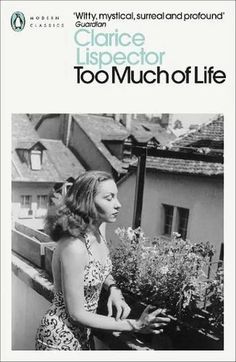 a woman standing on top of a roof next to a plant