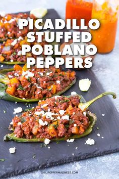 stuffed poblano peppers on a slate board with orange juice in the background and text overlay reading picadillo stuffed poblano peppers