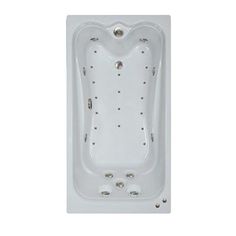 a white bath tub sitting on top of a white floor next to a wall mounted shower head