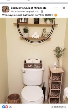 a white toilet sitting in a bathroom next to a wooden shelf