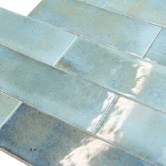 an image of a tile floor that looks like it has been painted blue and white