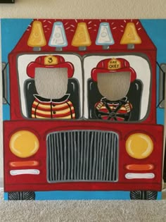 a painting of two children's firetrucks painted on the side of a wall