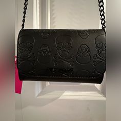 Betsey Johnson Faux Leather Embossed Skull & Crossbones Crossbody With Black Chain Accent Nwt. Black Faux Leather Crossbody Features An Embossed Skull And Crossbones Pattern On Flap, Front & Back Of Bag. Front With Black Toned Metal Betsey Johnson Logo Plate. Black Faux Leather Adjustable Crossbody Strap With Black Toned Metal Chain Accents & Buckle. Inside Bag When Flap Lifted Card Slots And A Zip Picket, Zipper Pull Black And Stamped Xox Betsey. Main Compartment With Open Slip Pocket With Card Skull Crossbones, Inside Bag, Betsey Johnson Bags, Skull And Crossbones, Black Chain, Heart Print, Black Faux Leather, Metal Chain, Crossbody Strap