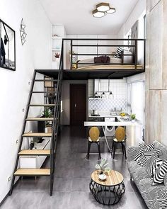 a living room filled with furniture next to a staircase leading up to a loft bed