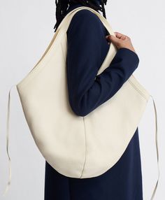 !!!Description---Our suede-lined Italian leather Soft M Hobo bag has an oversized, graphic shape designed to tote all your everyday belongings. For added versatility, four interior ties can be knotted to give the bag more structure or left open for a slouchier silhouette. !!!Fits---16" Laptop !!!Details---Width at base: 10.24 in / 26 cmWidth at Top: 20 in / 51 cmHeight : 12.6 in / 32 cmDepth : 0.79 in / 2 cmHandle Drop: 12.2 in / 31 cm Composition:Outer: 100% Italian Embossed Cow LeatherLining: Graphic Shapes Design, Oversized Bag, Base 10, Product Ideas, Mansur Gavriel, Leather Conditioner, Monogrammed Items, Light Orange