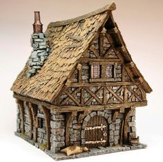 a small house made out of wood and stone