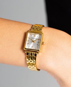 An iconic design, elevated. Combining the classic style of old vintage watches with an ultra-modern appeal in elegant yet eccentric gold, silver and white. The mini square-shaped 31mm dial features minimalist numerals with a delicate sunray dial and crystal detailing. Boyfriend pairs classic design with robust links made of gold-plated stainless steel. Trendy Watches Women Fashion, Casio Vintage Watch, Rolex Watches Women, Trendy Watches, Timeless Watches, Watches Women