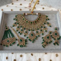 Antique gold polished necklace set made up of of champagne zircon crystals and faux tiny pearl drops and statement dark green glass beads.  Necklace comes complete with matching tikka, and earrings measuring around 3 inch in length and Optional jhumar. Necklace is adjustable to fit any size.  Ready to ship as seen with gift box. Bride Jewelry Set, Pearl Jewelry Design, Bridal Lehenga Red, Asian Jewelry, Jewelry Quotes, Bangles Jewelry Designs, Green Jewelry, Gold Polish, Bridal Jewelry Sets