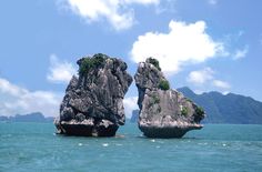 two large rocks sticking out of the ocean