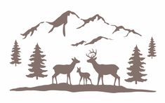 three deer standing in front of trees and mountains