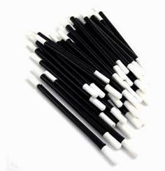 black and white straws are lined up together