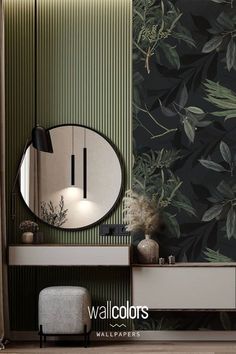 a bathroom with green wallpaper and a round mirror on the sideboard next to it