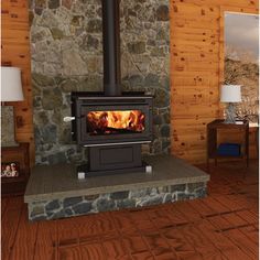 a wood burning stove sitting inside of a living room