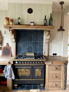 an old fashioned stove and oven in a kitchen