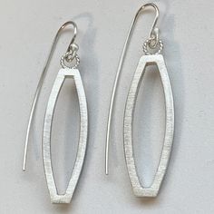 Sterling Silver Open Weave Lightweight Earrings hangs 2 inches from top of ear wire  1/2 inch wide  Stamped .925 Sterling Silver  Oval Shaped  Textured Finish Lightweight Earrings  Earrings you can live in! Our Jewelry is handmade with Love using Solid Sterling Silver Stamped .925 in my studio! PROCESSING TIME: 1 day! SHIPPING: US Orders Ship 1st Class Mail in 2 BUSINESS DAY! With A Tracking # ! SHOP POLICY: My Shop is open Monday thru Friday! Closed on weekends and holidays. But I do check on and will reply to all messages through out the weekend! CARE INSTRUCTIONS: Sterling silver jewelry looks great with your beachwear but don't go in the water with them. They will tarnish and can become damaged by exposure to pool and saltwater. Water, in and of itself, doesn't cause damage. Keep your Modern Oval Teardrop Earrings For Pierced Ears, Modern Oval Pierced Earrings, Modern Oval Earrings With Ear Wire, Modern Oval Single Earring, Elegant Metal Oblong Earrings, Minimalist Oval Metal Earrings, Minimalist Sterling Silver Oblong Earrings, Modern Oblong Sterling Silver Earrings, Modern Sterling Silver Oblong Earrings