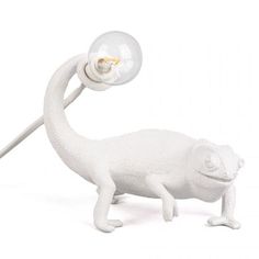 a white plastic animal with a light bulb on its head