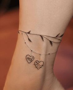 a woman's foot with two hearts on it