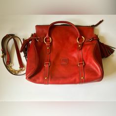 Never Used Been In Closet Storage. Pictures Of Any Wear. Red Travel Bag With Brass Hardware, Classic Red Bags With Brass Hardware, Red Shoulder Bag With Brass Hardware For Everyday Use, Elegant Red Bag With Brass Hardware, Elegant Red Shoulder Bag With Brass Hardware, In Closet Storage, Dooney & Bourke Bags, Closet Storage, Dooney Bourke