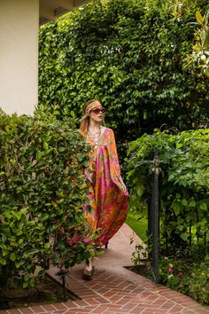 This colorful caftan is the answer to glam layering. Made with a yards of ultralight satin rayon and lots of love. Bohemian splendor, handmade in California. Our caftans are a voluminous one-size fits all garment, approximately 50" in length. The intention of this shape is to celebrate the magic of fabric and its captivating dance with form. JG one-size caftans are collected from petite to plus sized collectors, and everything in between. Machine wash cold, gentle cycle, and hang dry for optimal Oversized Bohemian Multicolor Maxi Dress, Bohemian Multicolor Kaftan, Multicolor Bohemian Shawl Kaftan, Bohemian Multicolor Shawl Kaftan, Pink Bohemian Maxi Kimono, Multicolor Silk Maxi Dress For Festivals, Bohemian Silk Maxi Kaftan, Pink Bohemian Kaftan With Kimono Sleeves, Bohemian Long Silk Kaftan